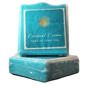 Two Seaside Spa Soap Bars sit on a bright white background. They are sky blue colored and feature Coconut Cream Soap's logo of a smiling sun with the words 'Coconut Cream Soap to Spoil You" written beneath.
