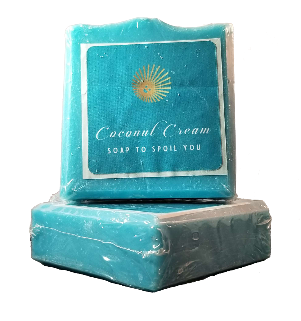Two Seaside Spa Soap Bars sit on a bright white background. They are sky blue colored and feature Coconut Cream Soap's logo of a smiling sun with the words 'Coconut Cream Soap to Spoil You" written beneath.